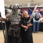 pic of linnea tanner with a viking at a comic con event