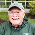 headshot photo of author dewayne rahe