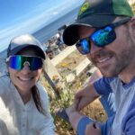 fun headshot beach pic of authors Elysia and Mark Stevens