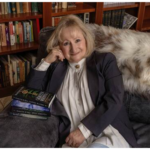 picture of author marlene m. bell sitting on a sofa