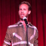 photo of poet craig kite at a microphone