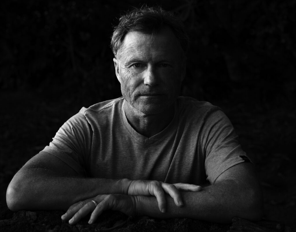 b&w headshot photo of author Alex Woodard