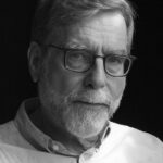 black and white headshot image of author forest mcmullin