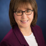 headshot photo of author jean burgess